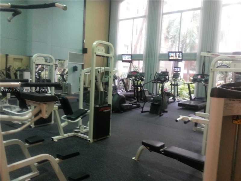 17150 North Bay Road, Unit 2422 Sunny Isles Beach, FL 33160 - Photo 7 of 9 a room with gym equipment