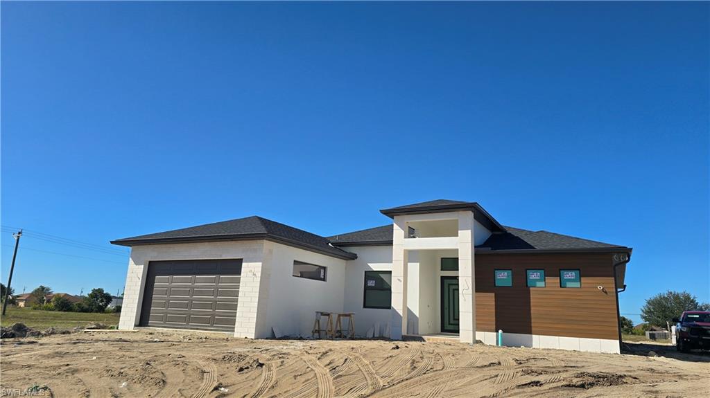 2006 Nelson Road North Cape Coral, FL 33993 - Photo 1 of 50 a front view of a house with a yard