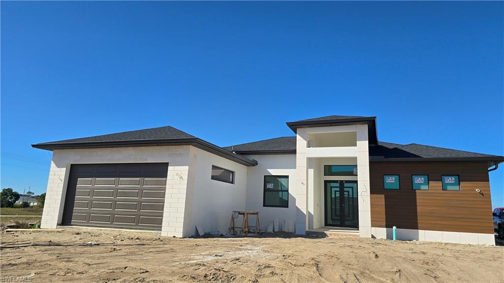 2006 Nelson Road North Cape Coral, FL 33993 - Photo 2 of 50 a front view of a house