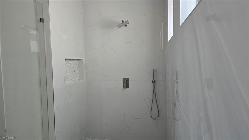 2006 Nelson Road North Cape Coral, FL 33993 - Photo 28 of 50 a bathroom with a shower
