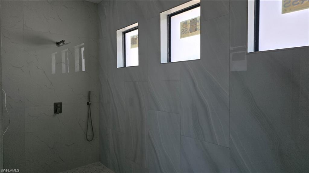 2006 Nelson Road North Cape Coral, FL 33993 - Photo 30 of 50 a bathroom with a window