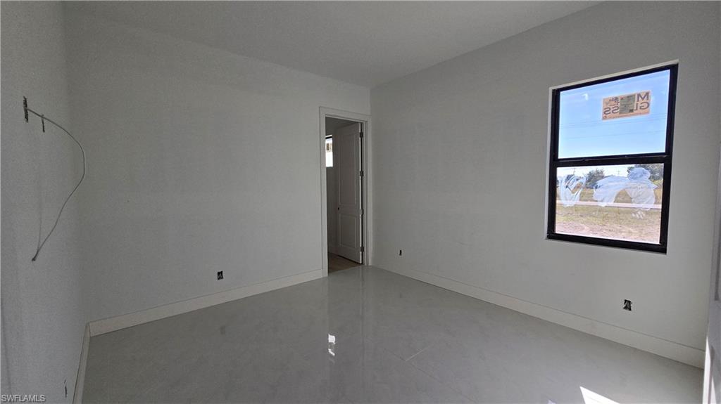 2006 Nelson Road North Cape Coral, FL 33993 - Photo 35 of 50 an empty room with a window