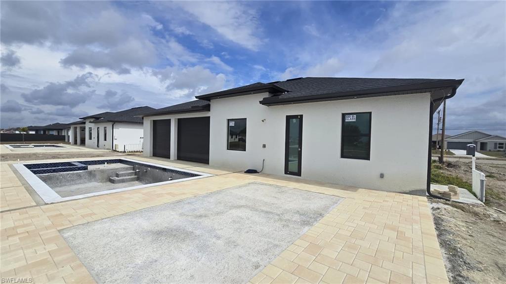 2006 Nelson Road North Cape Coral, FL 33993 - Photo 4 of 50 a house view with a outdoor space