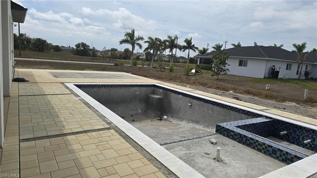 2006 Nelson Road North Cape Coral, FL 33993 - Photo 6 of 50 a view of swimming pool from a balcony