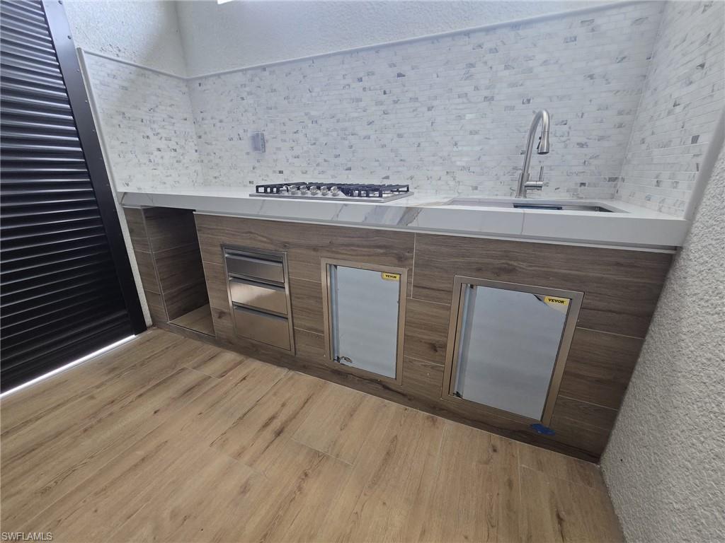 2006 Nelson Road North Cape Coral, FL 33993 - Photo 8 of 50 a kitchen with a stove and cabinets