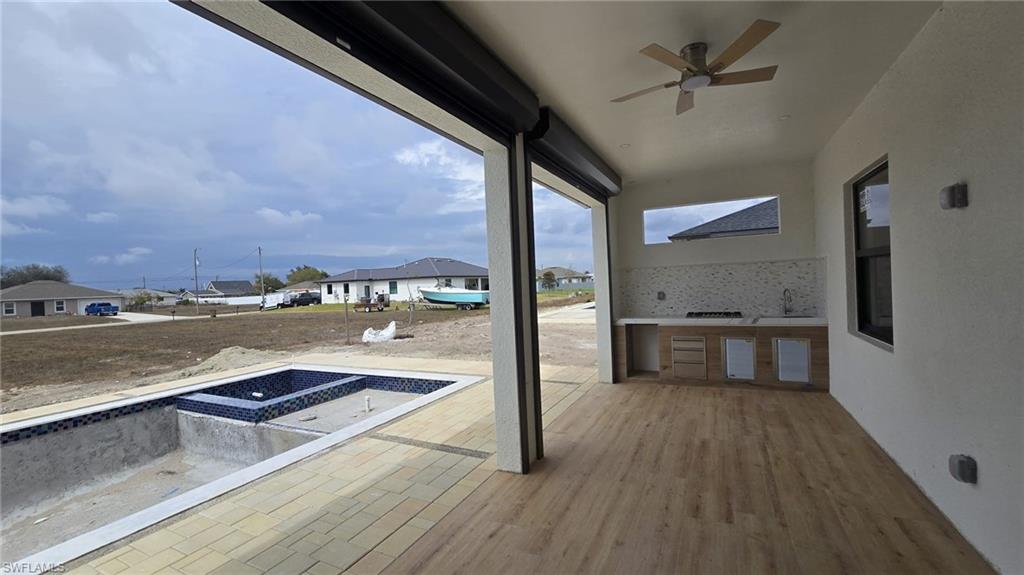 2006 Nelson Road North Cape Coral, FL 33993 - Photo 9 of 50 a view of a living room and kitchen with a large window