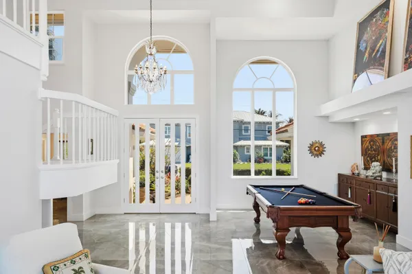 a living room with lots of furniture and a large window