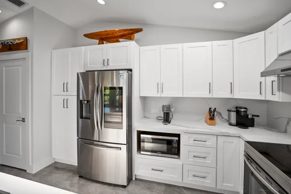 a bedroom with a bed and a cabinets