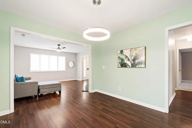 a spacious bedroom with a bed and a large window