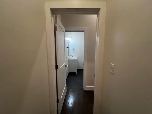 a view of a bathroom from a hallway