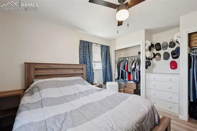 a bedroom with a large bed and a walk in closet