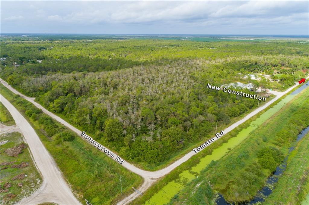 11075 Tomato Road Naples, FL 34114 - Photo 1 of 10 a view of lake from a window