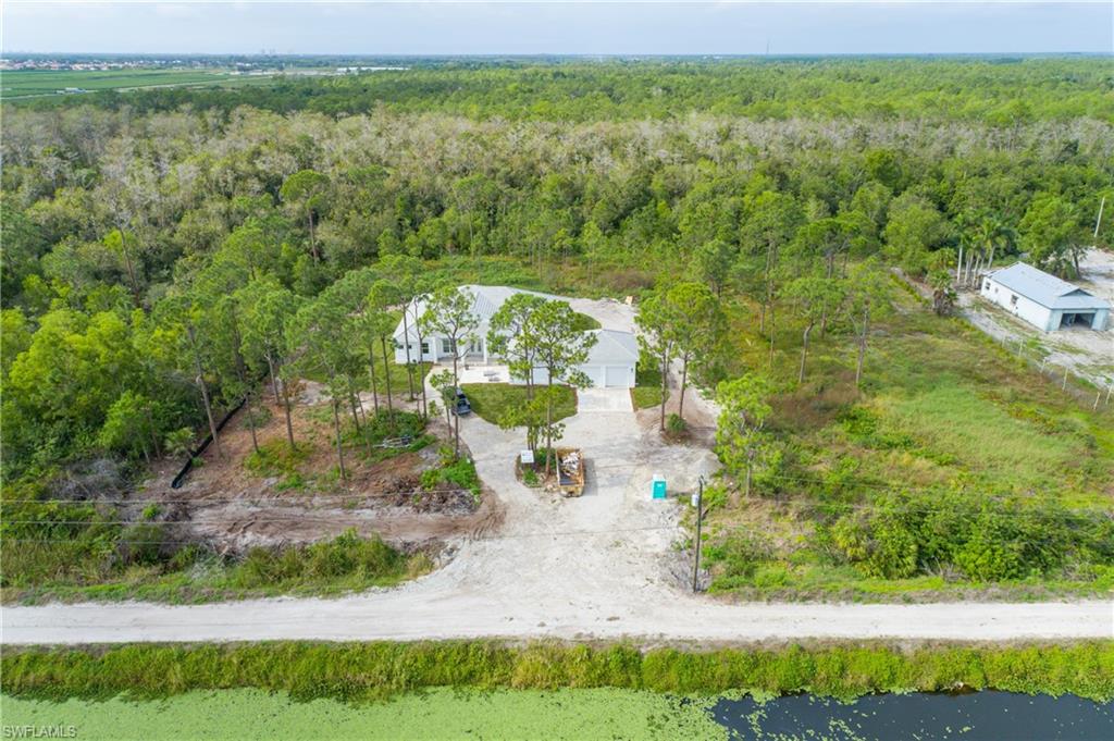 11075 Tomato Road Naples, FL 34114 - Photo 3 of 10 a view of a yard