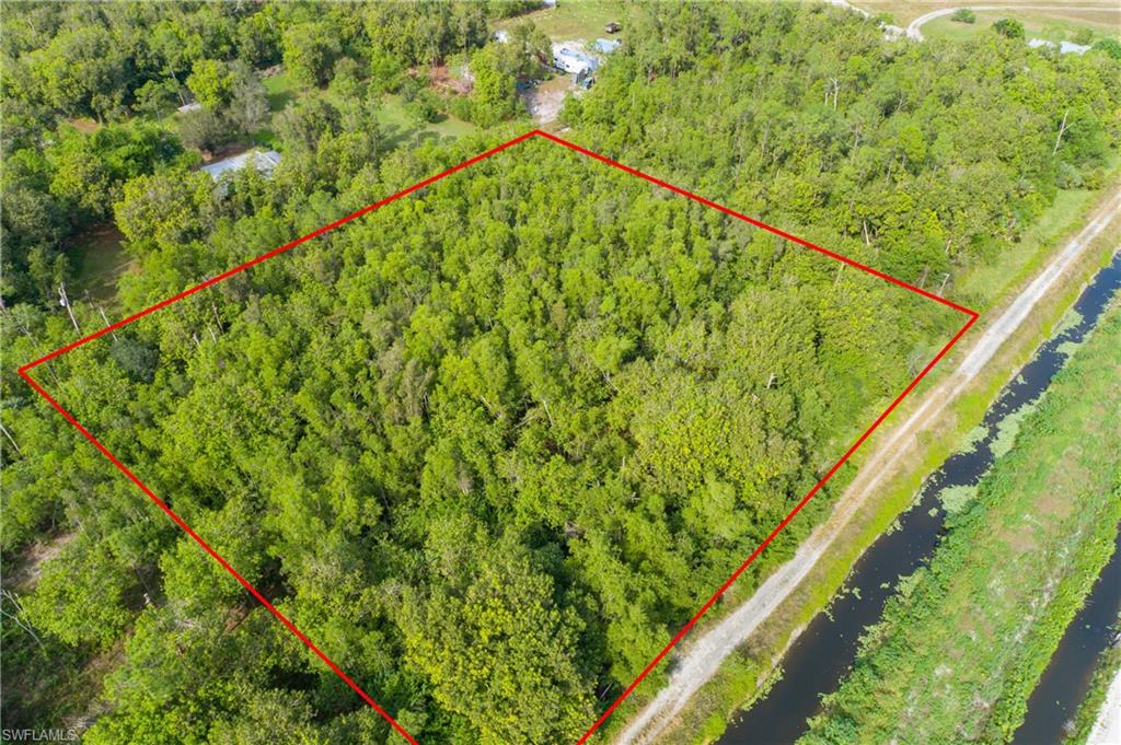 11075 Tomato Road Naples, FL 34114 - Photo 8 of 10 a view of mountain with a garden