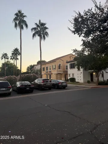 a view of street with parked cars