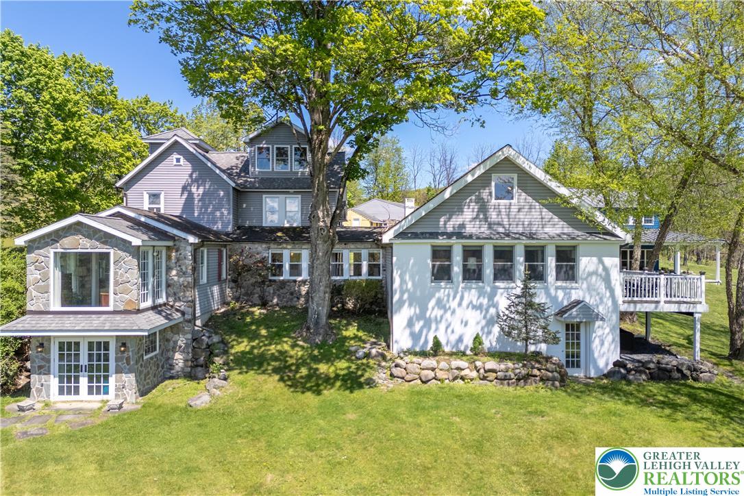 1072 5 Points Richmond Road Bangor, PA 18013 - Photo 65 of 66 a front view of a house with a garden and trees