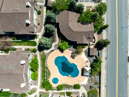 an aerial view of a house with a yard and potted plants