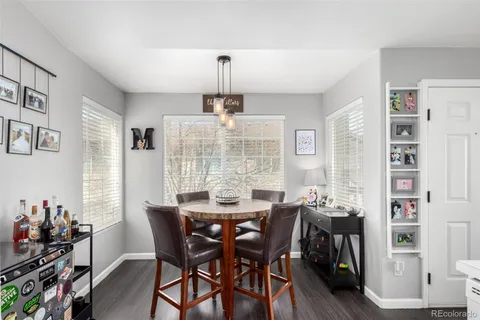 a view of a dining room with furniture and chandelier