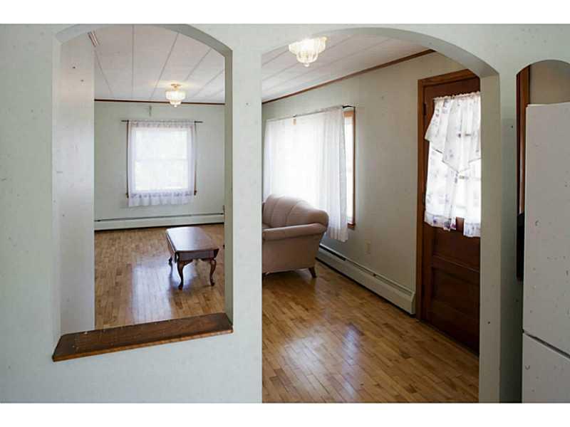 413 Main Street Corinth, ME 04427 - Photo 17 of 30 Kitchen. Open archway to living room