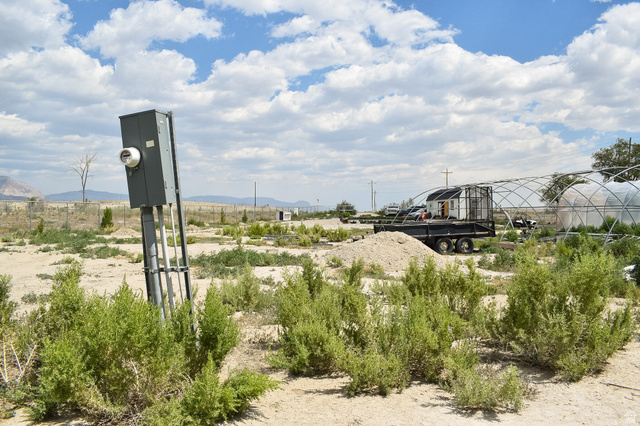 345 North Main Street Clawson, UT 84516 - Photo 11 of 17 Electrical service pole with meter and conduits, surrounded by low-lying scrub