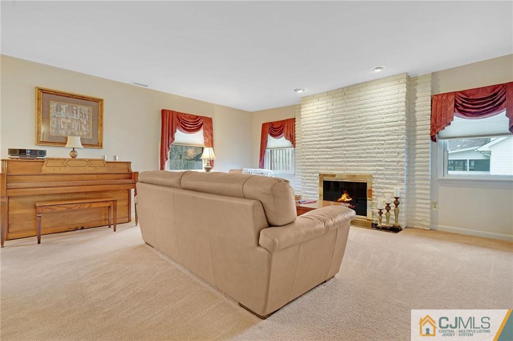 16 Crabtree Road Old Bridge, NJ 07747 - Photo 13 of 25 a living room with furniture and a fireplace