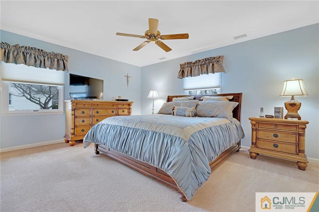 16 Crabtree Road Old Bridge, NJ 07747 - Photo 14 of 25 a bedroom with a bed and ceiling fan