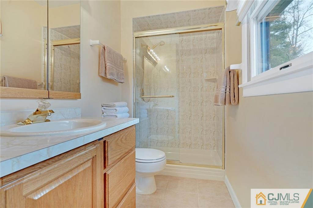 16 Crabtree Road Old Bridge, NJ 07747 - Photo 15 of 25 a bathroom with a sink a toilet and shower