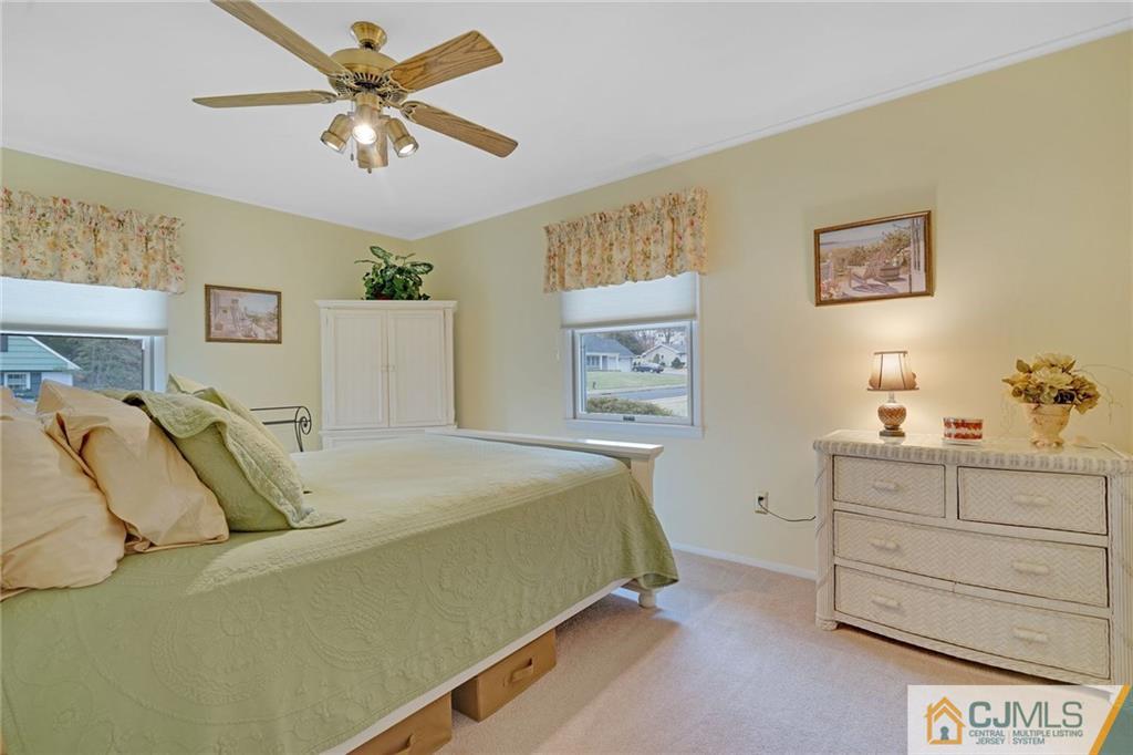 16 Crabtree Road Old Bridge, NJ 07747 - Photo 16 of 25 a bedroom with a bed and a chandelier