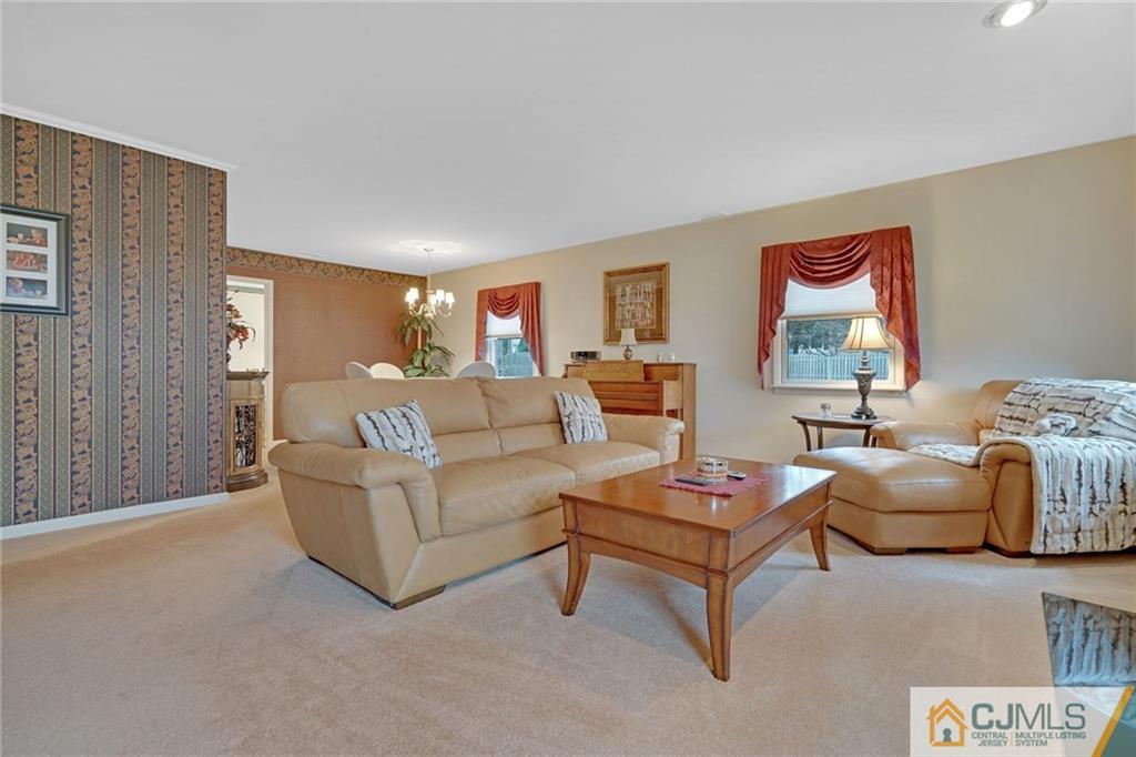 16 Crabtree Road Old Bridge, NJ 07747 - Photo 5 of 25 a living room with furniture and a rug