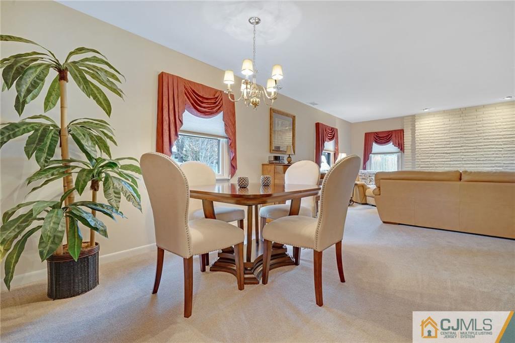 16 Crabtree Road Old Bridge, NJ 07747 - Photo 6 of 25 a dining room with furniture potted plants and wooden floor