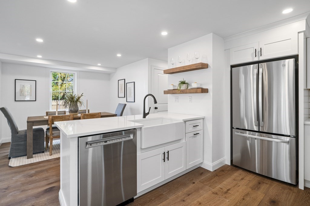 43 Needham Road, Unit 2 Danvers, MA 01923 - Photo 17 of 42 a kitchen with white cabinets and sink