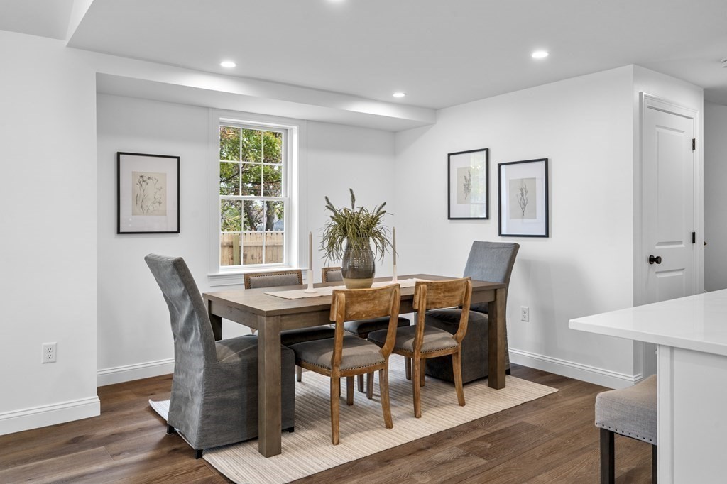 43 Needham Road, Unit 2 Danvers, MA 01923 - Photo 18 of 42 a view of a dining room with furniture and wooden floor