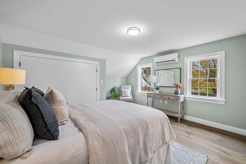 43 Needham Road, Unit 2 Danvers, MA 01923 - Photo 22 of 42 a bedroom with a bed and wooden floor