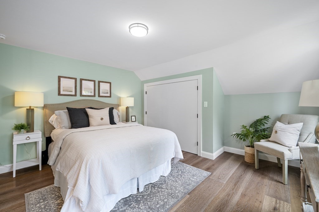 43 Needham Road, Unit 2 Danvers, MA 01923 - Photo 23 of 42 a bedroom with a bed and a couch