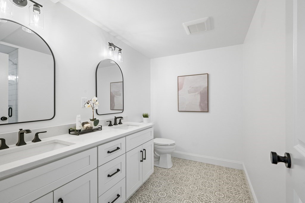 43 Needham Road, Unit 2 Danvers, MA 01923 - Photo 24 of 42 a bathroom with 2 sink and a mirror