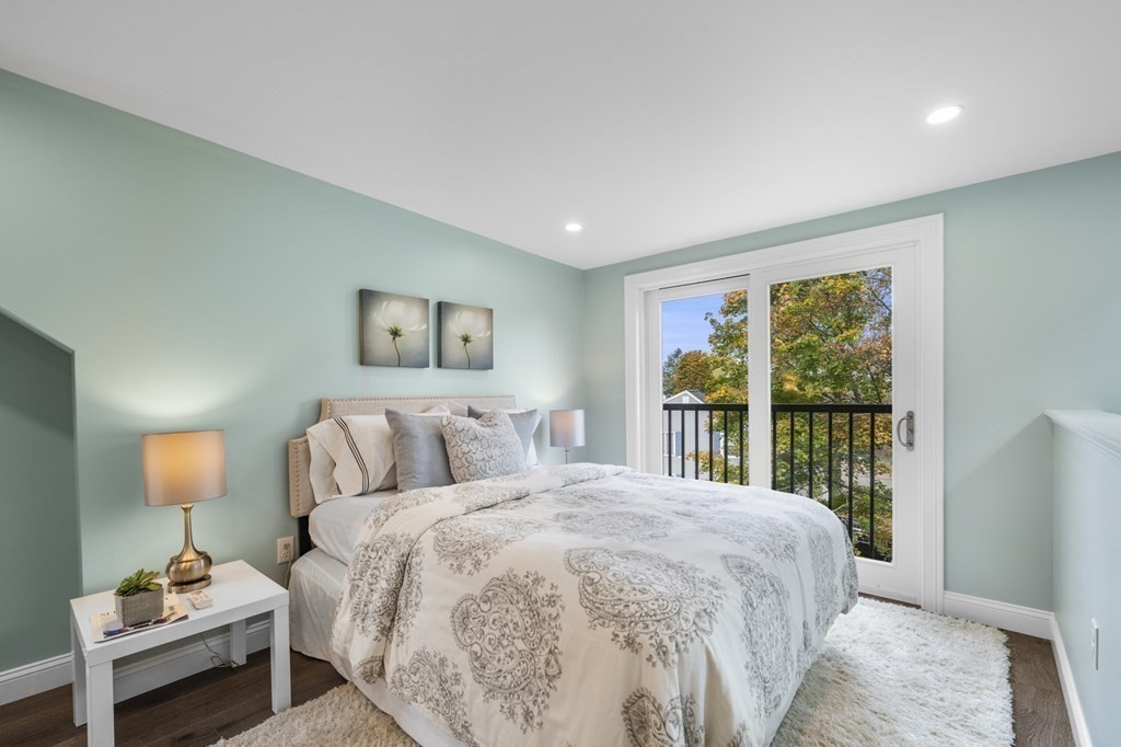 43 Needham Road, Unit 2 Danvers, MA 01923 - Photo 30 of 42 a bedroom with a large bed and a window