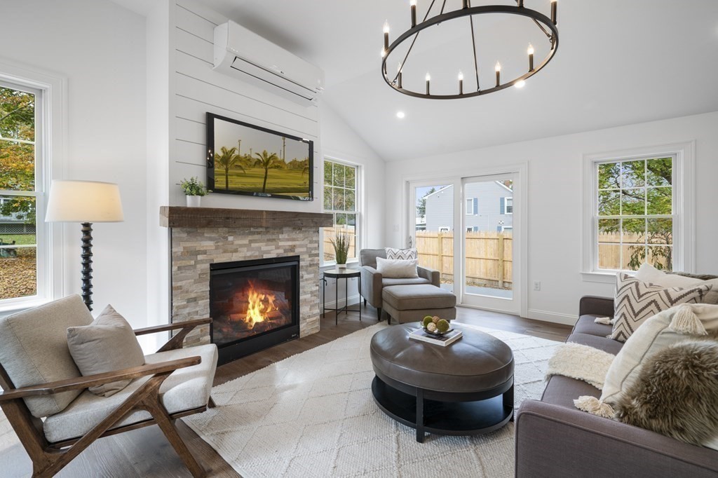 43 Needham Road, Unit 2 Danvers, MA 01923 - Photo 3 of 42 a living room with furniture a window and a fireplace