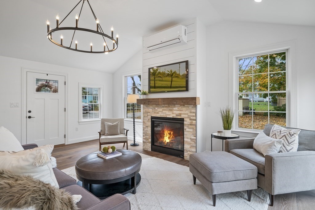 43 Needham Road, Unit 2 Danvers, MA 01923 - Photo 8 of 42 a living room with furniture a window and a fireplace