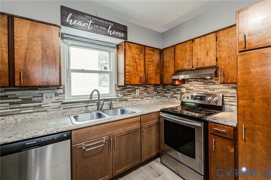 709 Deter Road Richmond, VA 23225 - Photo 6 of 38 Kitchen featuring wood cabinetry, stainless steel