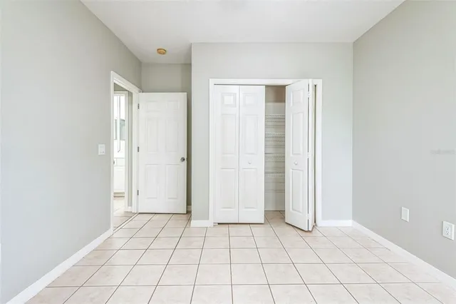 a bathroom with a double vanity sink mirror and shower
