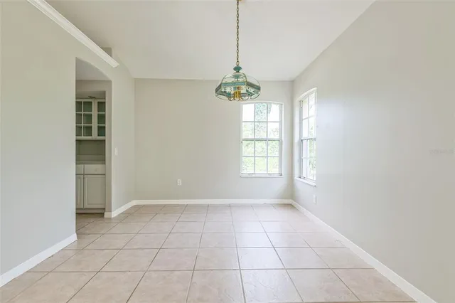 a kitchen with stainless steel appliances kitchen island sink refrigerator and microwave