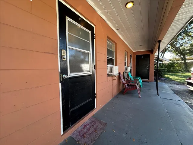 a view of an empty room with a balcony