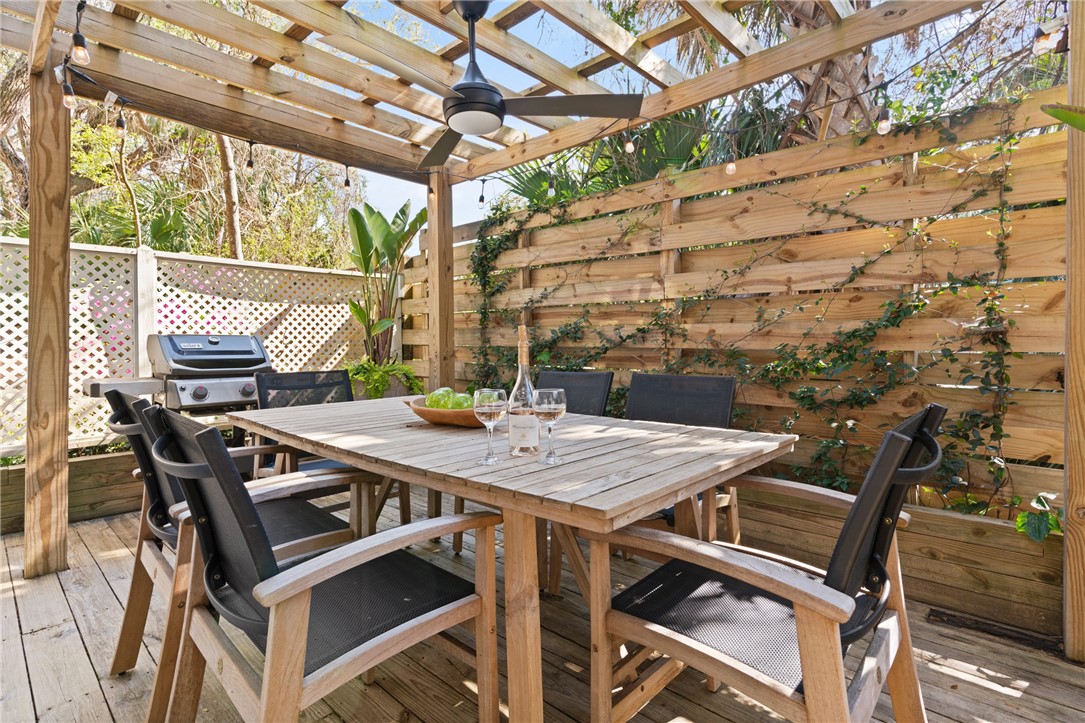 1460 Ocean Boulevard, Unit 108 St. Simons Island, GA 31522 - Photo 18 of 36 private back deck area with pergola