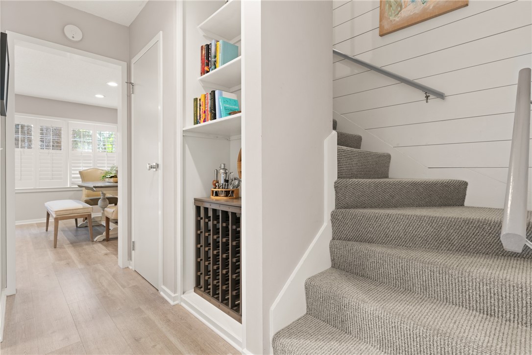 1460 Ocean Boulevard, Unit 108 St. Simons Island, GA 31522 - Photo 9 of 36 bookcase nook next to staircase