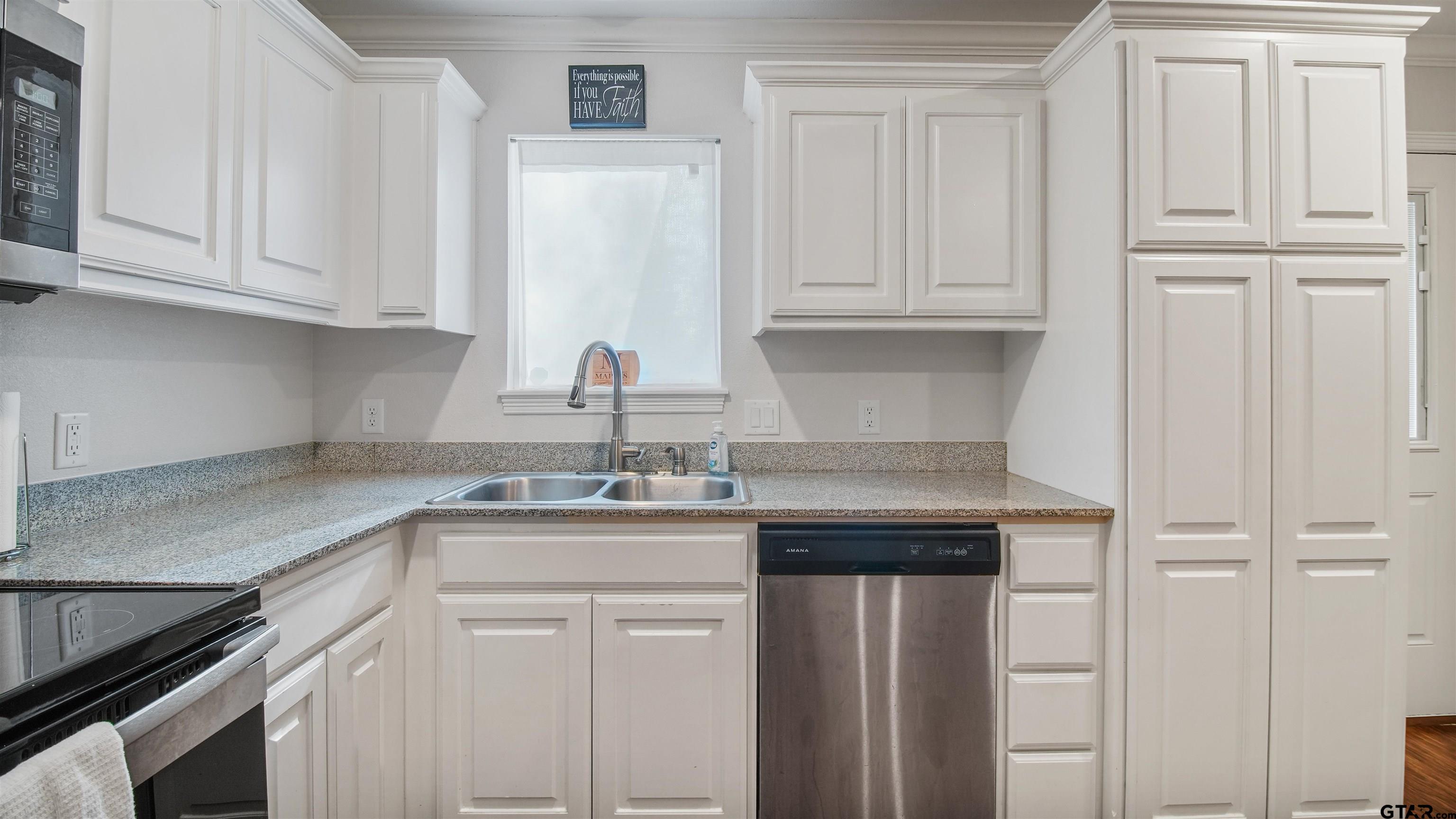 2220 Walton Road Tyler, TX 75701 - Photo 14 of 29 a kitchen with stainless steel appliances granite countertop white cabinets and a sink
