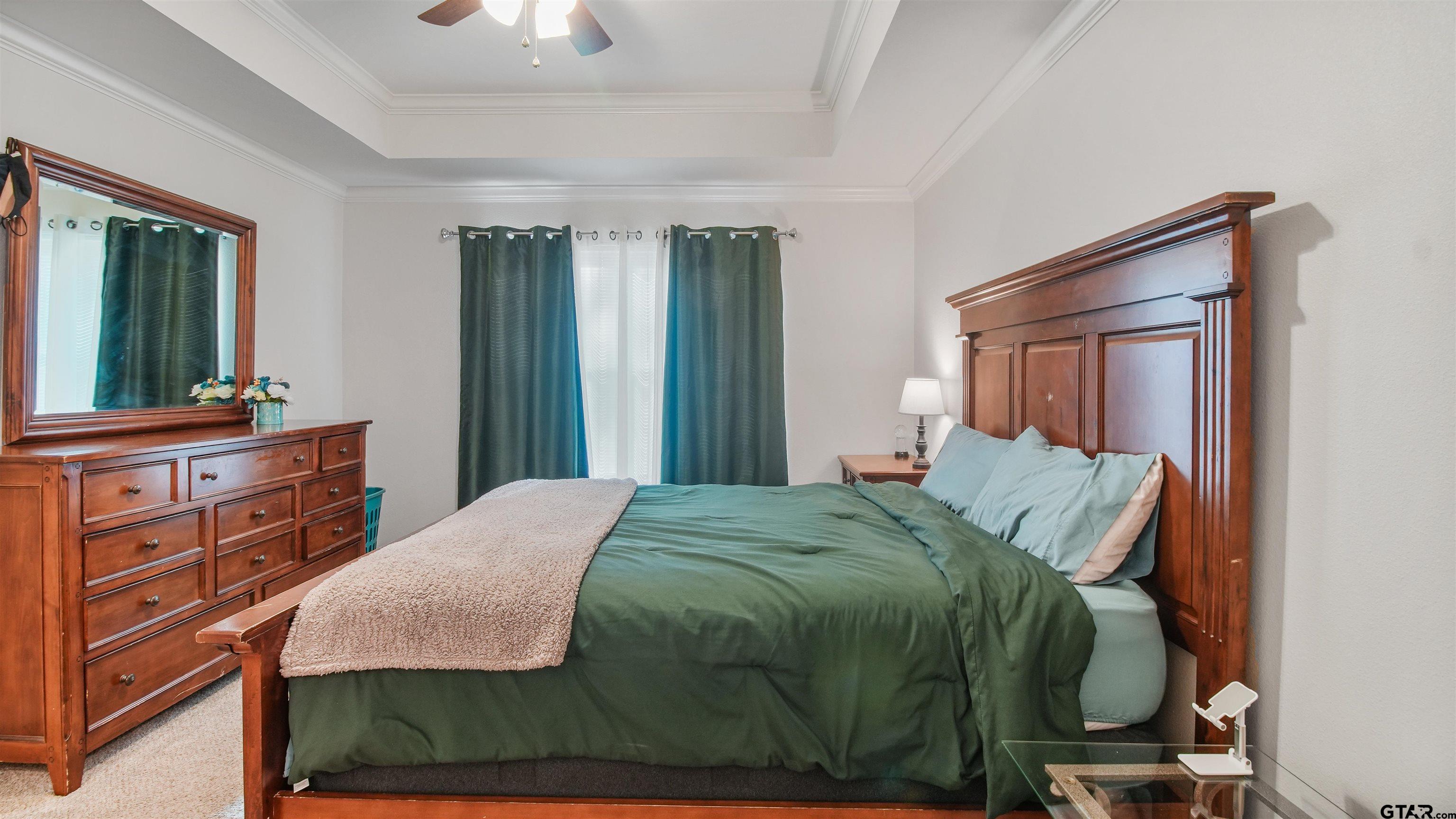 2220 Walton Road Tyler, TX 75701 - Photo 16 of 29 a bedroom with a bed and a dresser