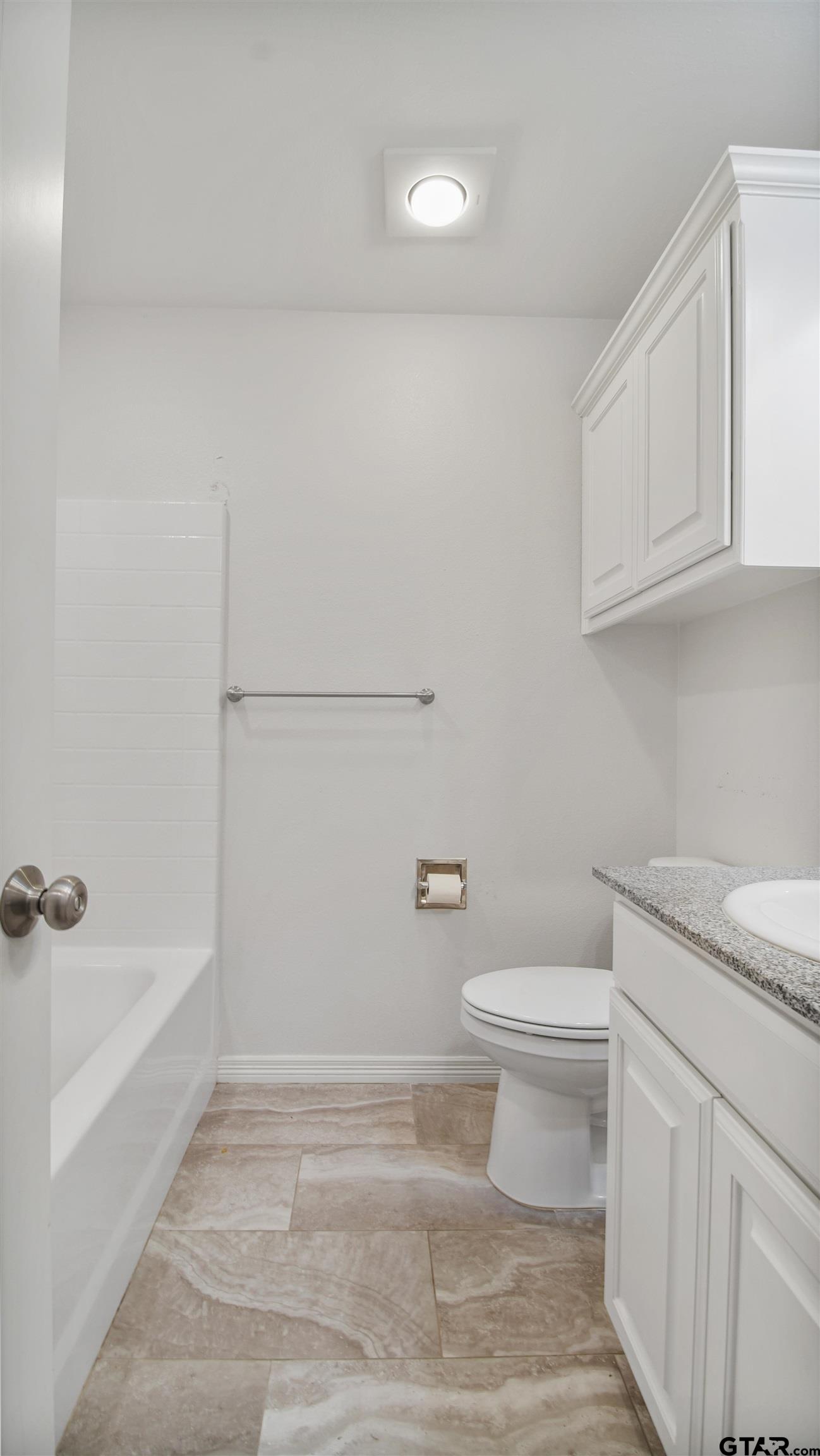2220 Walton Road Tyler, TX 75701 - Photo 25 of 29 a bathroom with a sink a toilet and vanity