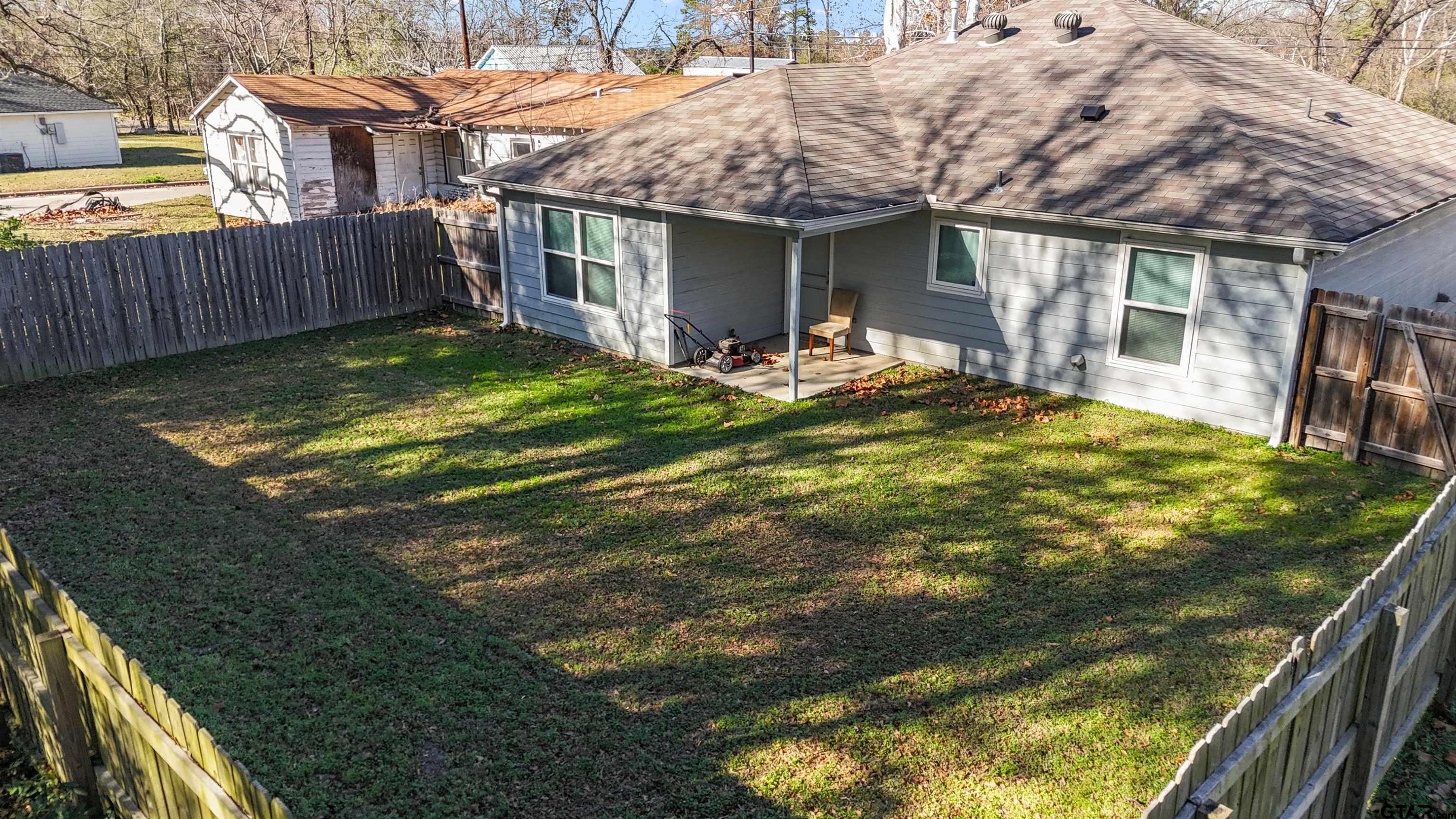 2220 Walton Road Tyler, TX 75701 - Photo 29 of 29 a view of a house with backyard and porch