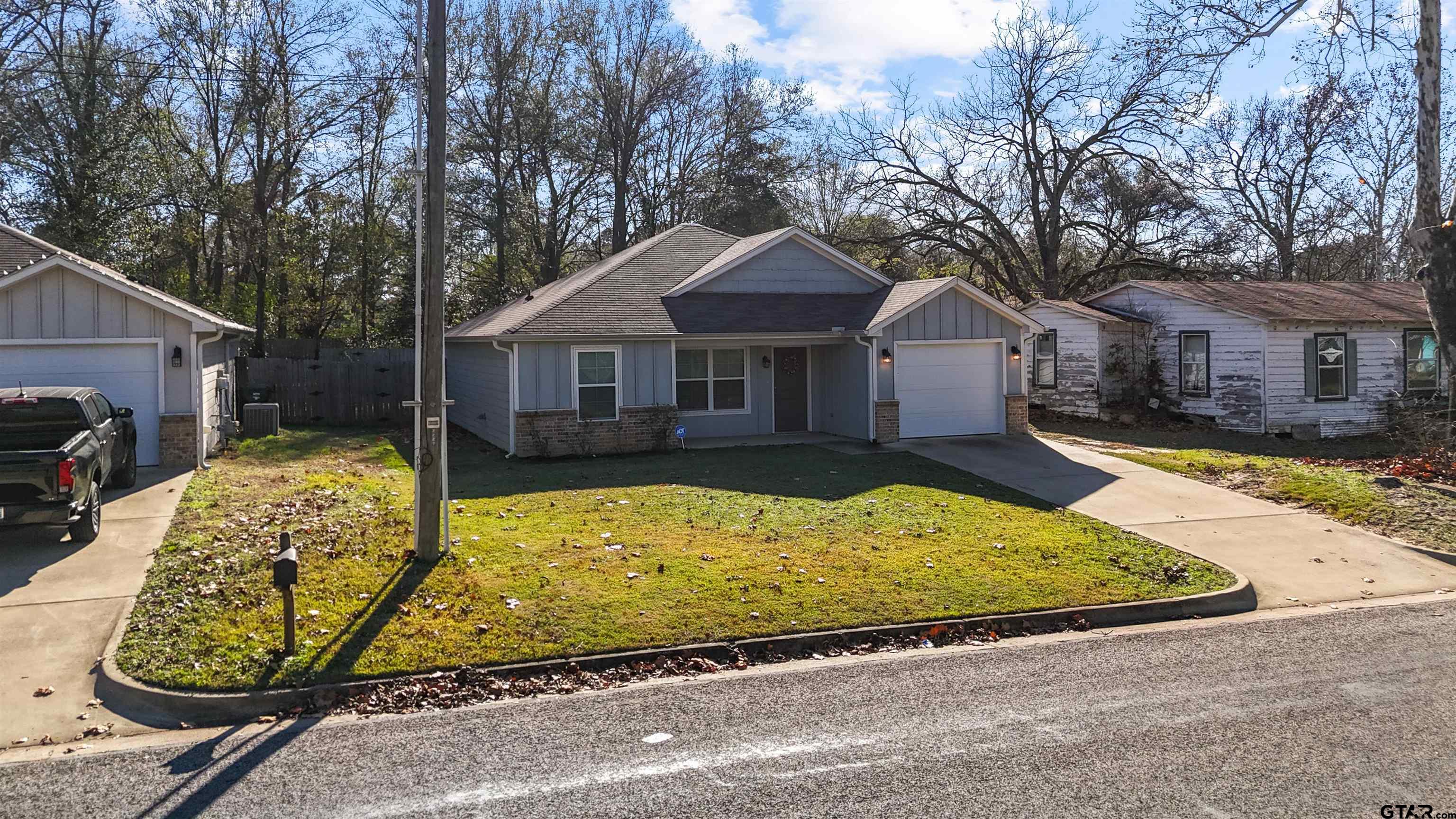 2220 Walton Road Tyler, TX 75701 - Photo 3 of 29 a front view of a house with garden