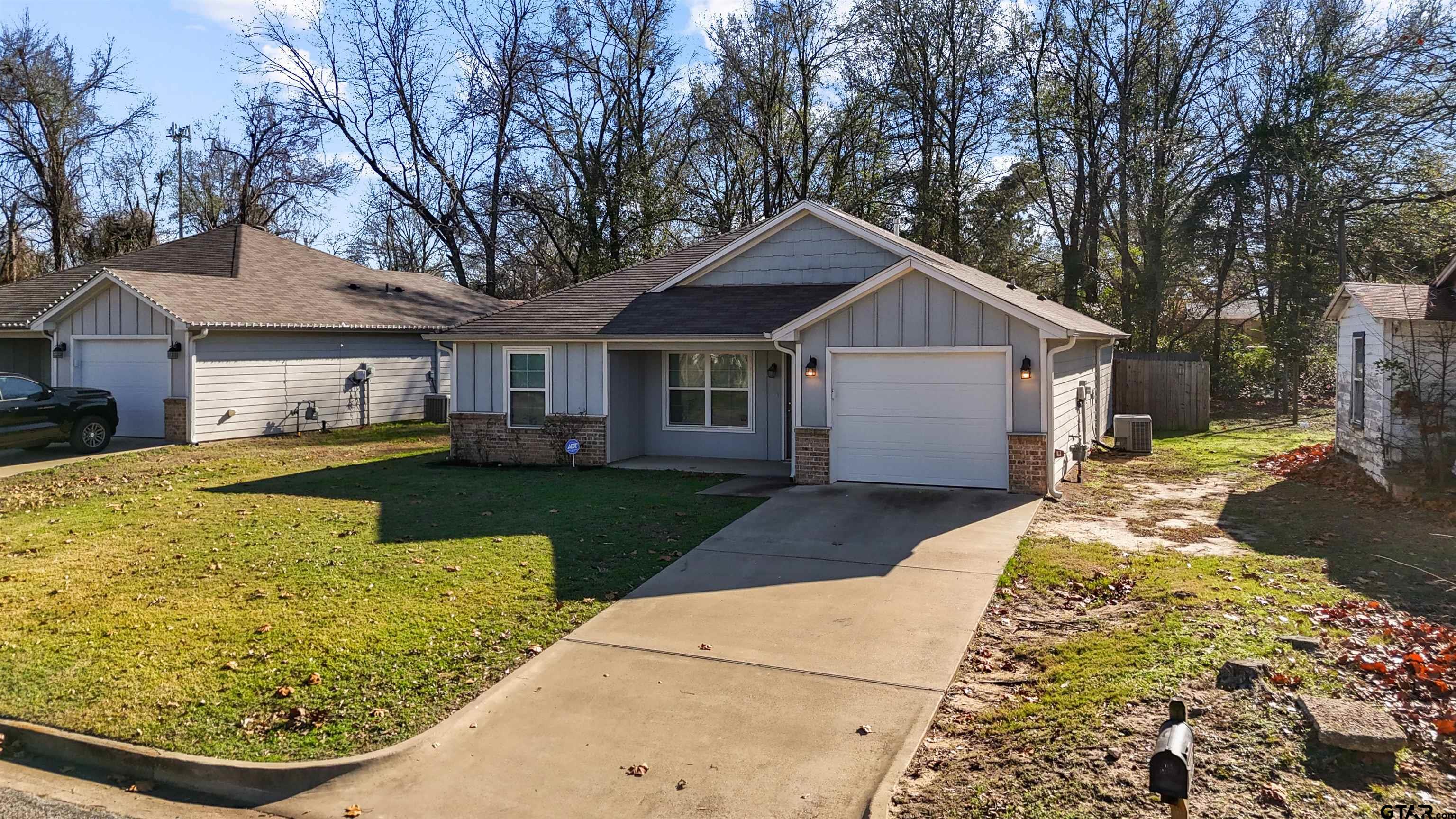 2220 Walton Road Tyler, TX 75701 - Photo 7 of 29 a front view of a house with garden